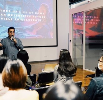 A dynamic snapshot of a keynote speaker presenting innovative AI-supported research at a global event.